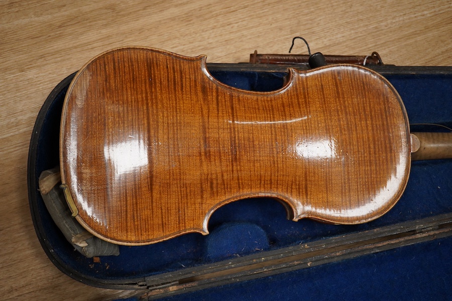 Two cased violins; one French 19th century bearing a hand written label for Francesco Werentle 1746, body length 35.5cm, the other an early 20th century violin, body length 35cm. Condition - poor.